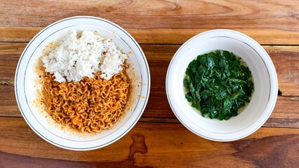Instant fried noodles with rice and bowl of moringa soup.