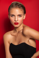 young blond fashion model with red lips