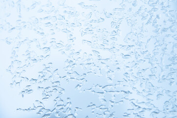 Abstract blue background. Texture of frozen water, ice
