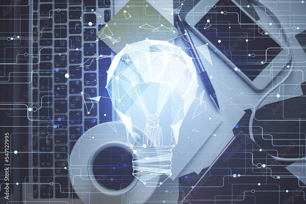 Poster Bulb drawing over computer on the desktop background. Top view. Double exposure. Idea concept.