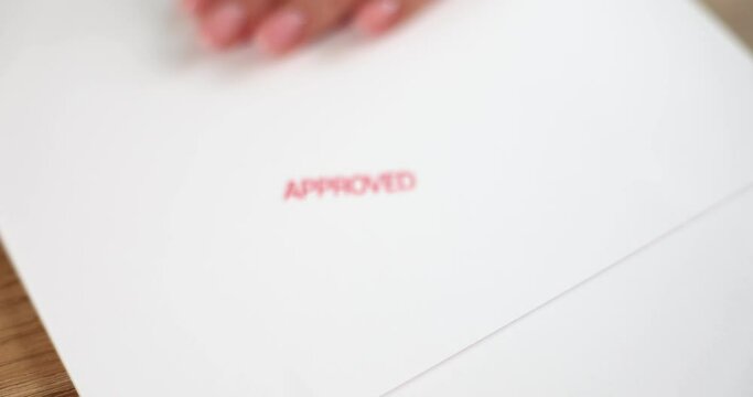 Stamp the word approved on empty white paper
