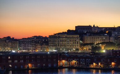 Residential Apartment Home Buildings in Historic Downtown City on Mediterranean Coast of Naples, Italy. Sunset Sky.