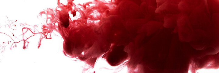 Red color flowing in smoke forms, smooth abstract moving by acrylic paint