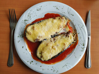 Filled aubergines at a restaurant.