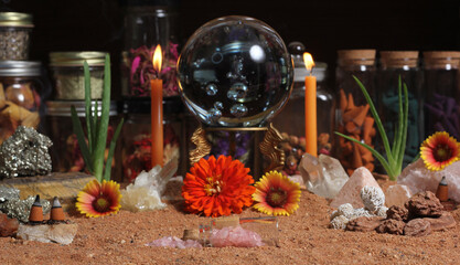 Crystal Ball With Candles and Chakra Stones on Australian Red Sand