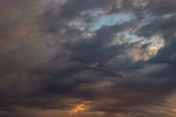 Naklejka na ściany i meble Dramatic or cinematic cloudscape at sunset or sunrise.