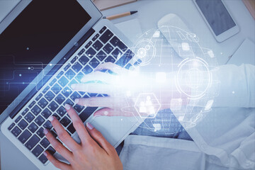 Double exposure of woman hands working on computer and social network theme hologram drawing. Top View. People connection concept.