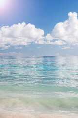 Tropical seascape white cloud above blue sea.