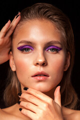 young blond fashion model with bright make up