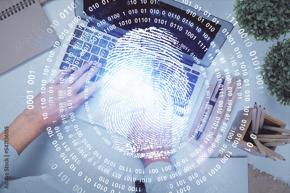 Poster double exposure of woman hands working on computer and fingerprint hologram drawing. top view. digit