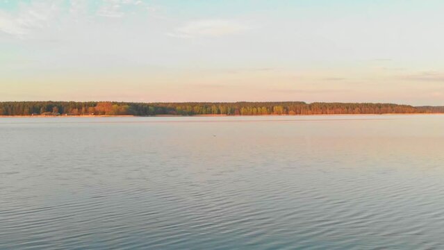 Static Shot Of Rocky BAy On Blue Calm Water Lake, Jugla, Riga, Latvia