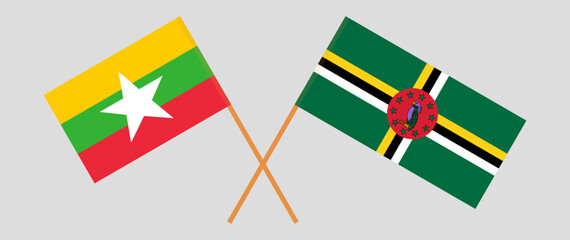 Crossed flags of Myanmar and Dominica. Official colors. Correct proportion