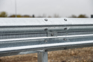 Brand new metallic road barrier for traffic safety on a new constructed road
