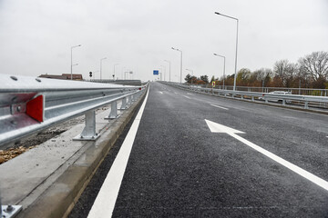 Brand new metallic road barrier for traffic safety on a new constructed road