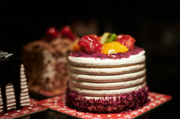 delicious beautiful colorful little cake with strawberries and fruits