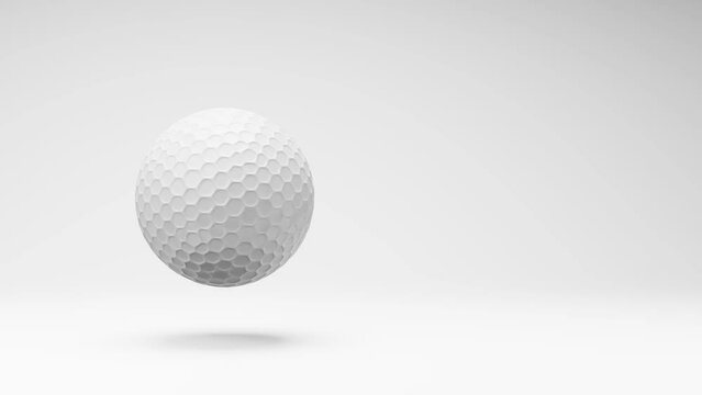 Golf Ball Spinning on a Studio Light Gray Background, Seamless Loop 3D Animation with Copy Space
