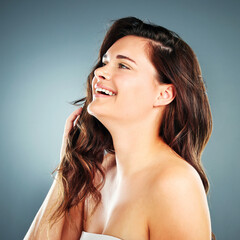 Obraz premium Beauty, skincare and hair with woman and smile for facial, product and spa luxury. Self love, happy and hair care with face of girl model for cosmetics, makeup and salon in studio background