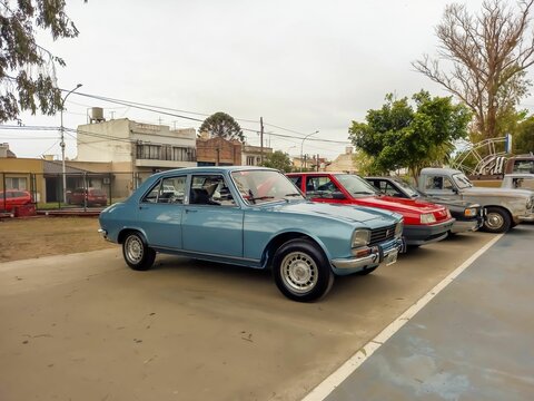 stylish light blue Peugeot 504 sedan family car 1969-1999 in a park