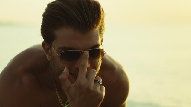 Handsome guy with sunglass smiling 