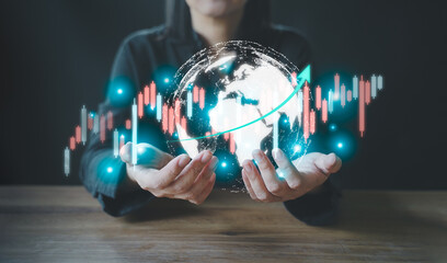 Hand holding a globe on a virtual screen with a stock chart. Concept of analyzing stock prices, exchange rates, cryptocurrencies, forex trading, global currency exchange, financial technology.