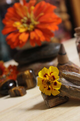 Obraz na płótnie Canvas Flowers and Incense Cone With Palo Santo Sticks on Meditation Table