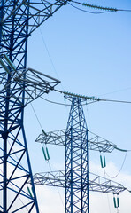 Power lines against the blue sky