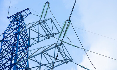 Power lines against the blue sky