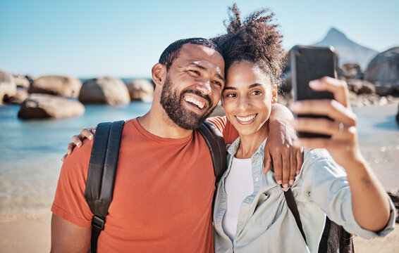 Couple, phone selfie and beach travel adventure together for social media, holiday vacation and summer in nature. Man, happy woman and hug for mobile phone photograph at ocean sea for happiness
