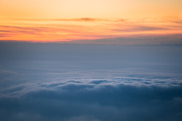 Fototapeta na wymiar Low altitude clouds above the Pianura Padana a few minutes after sunset, Northern Italy