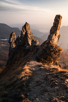 Sunset scene of a rocky cliff that overlooks the area near the Lake Como, Northern Italy