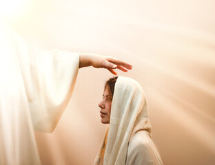 Blessing hand above the head of a woman in a headscarf