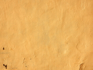Fondo de pared en Ibiza,España, con desconchones,textura sucia y rugosa en colores ocres