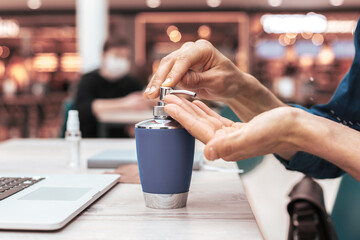 close up. man applying a decontaminating gel to his hands.