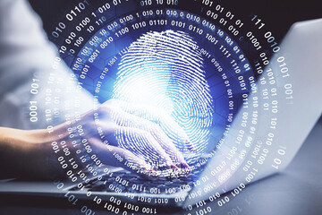 Double exposure of woman hands typing on computer and fingerprint drawing. Security concept.