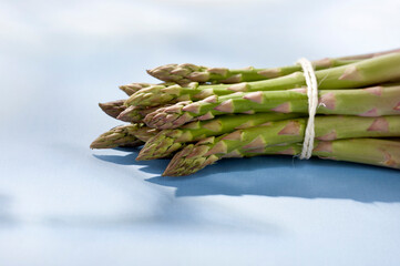 green asparagus on blue background