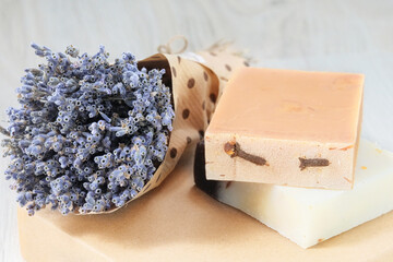 Soaps with natural ingredients on wooden background. Handmade natural cosmetics products.