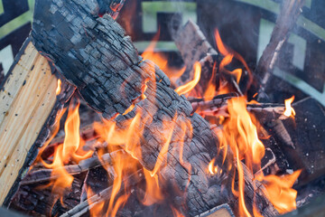 Firewood is burning beautifully in the campfire. - 547162542