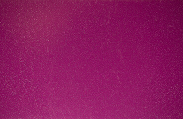 Pink background of decorative plaster with abstract spots. Unusual texture of this wall with beautiful patterns, creative surface background. Finishing coating for building cladding.