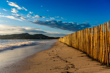 Scenic view of wooden fence at beach against dramatic sunset sky at Saint Tropez south of France