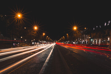 Fototapeta na wymiar Scenic view of traffic light trails on Champs Elysee in Paris at night