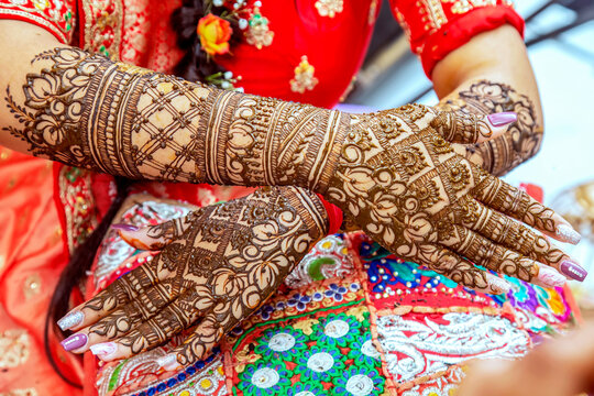 Beautiful henna design on the hand of a Hindu bride on her wedding eve.	
