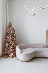 Modern interior with couch and christmas tree