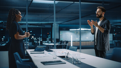 Futuristic Office Online Meeting Video Conference Call: Businesswoman and Businessman Talk using Augmented Reality Software. e-Business Solution For Virtual Work. Ultra Realistic Hologram Concept.