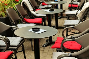 Street cafe empty tables on the outdoor terrace