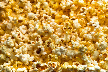 Golden caramel popcorn closeup background