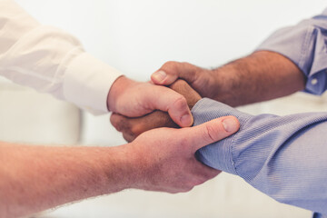 Handshake, contract deal or negotiation closeup at desk at a meeting between professionals. Business greeting, thank you or welcome gesture to show respect with new partnership or onboarding.