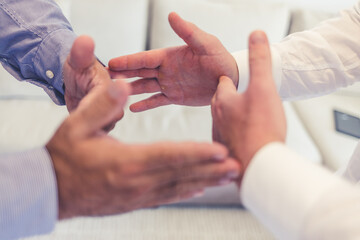 Teamwork, hands and circle in solidarity of two business persons in unity, collaboration and trust together at work. Trust, support or motivation of group at work/office in solidarity, unity or union.