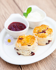 Cranberry scone set with raspberry jam and clotted cream