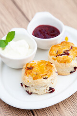 Cranberry scone set with raspberry jam and clotted cream