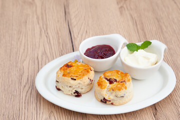 Cranberry scone set with raspberry jam and clotted cream